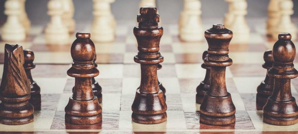 chess board with figures on the wooden table